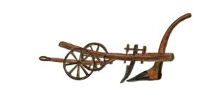 An illustration of a heavy plough made from a mixture of wood and metal