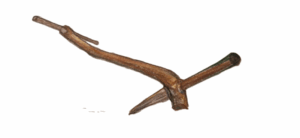 A sketch drawing of an early plough. Made from wood, it comprises of two block of wood. One sharpened to be pulled through the ground.