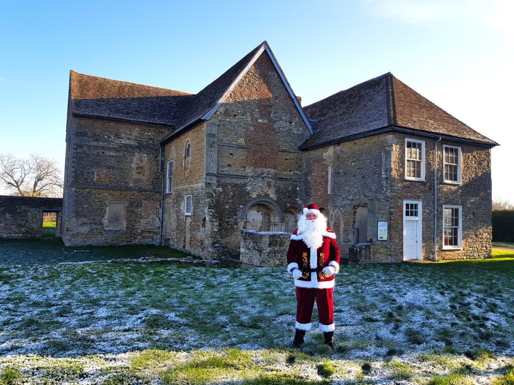 Santa standing in front of Denny Abbey